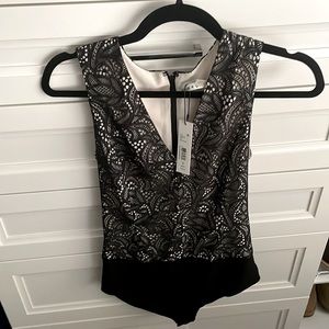 Alice and Olivia size S lace body suit. NWT!